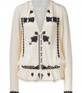 Exquisitely embellished with beaded black patterning, Day Birger et Mikkelsens cream blouse is a standout separate perfect for giving your work look a lift - V-neckline, long sleeves, buttoned front, elasticized waist with softly ruffled hemline - Feminine tailored fit - Team with everything from jeans and flats to pencil skirts and heels