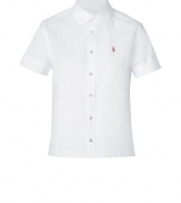 Styled with a slightly cropped boxy cut, Ralph Laurens white button-down is a modern take on this iconic style - Cutaway collar, short sleeves, slit cuffs, button-down front, straight hemline, slit sides - Slightly boxy, straight silhouette - Wear with figure-hugging separates and statement chunky jewelry