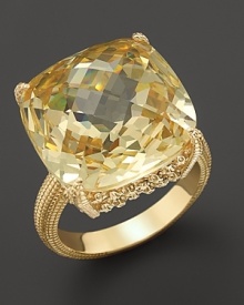 An elegant 18K gold ring with cushion cut canary crystal stone. By Judith Ripka.