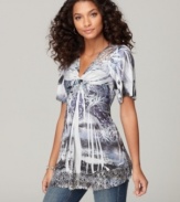 A seductively twisted front and lovely lace trim create a feminine look on One World's tunic top!