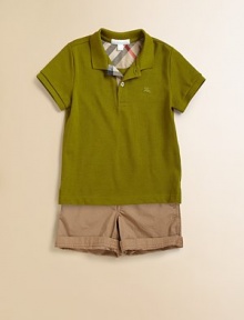 A classic, cotton knit with short sleeves and a check-lined button placket for your little man.Polo collarShort sleevesFront button placketSide vented hemCottonMachine washImported Please note: number of buttons may vary depending on size ordered. 