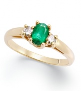 Enviable green hues. This vibrant 14k gold ring features an oval-cut emerald (3/8 ct. t.w.) and round-cut diamond side stones (1/8 ct. t.w.).