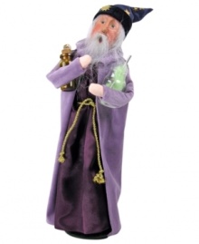 Shocked by the success of his own magic, this mystical wizard stands back to admire its results. Traditional wizarding garb – a star-patterned hat and long cloak – make the Byers' Choice figurine a Halloween favorite.