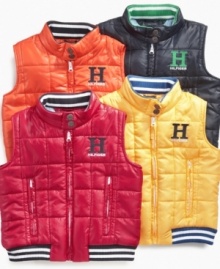 The perfect layering piece for fall, this Tommy Hilfiger puffer vest boasts a stylish varsity look.