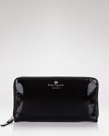 A simply chic continental wallet in glossy patent leather from kate spade new york.