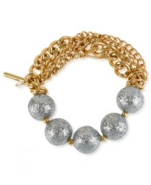 The ball's in your court with this half stretch bracelet from Kenneth Cole New York. Crafted from gold-tone mixed metal with silver-colored glitter beads. Item comes packaged in a signature Kenneth Cole New York Gift Box. Approximate diameter: 2-1/2 inches.