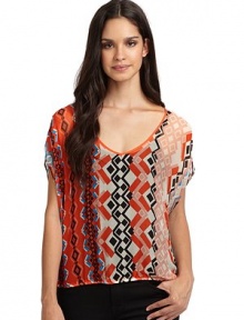 THE LOOKAllover tribal-inspired printElastic waistBack cutout detailTHE FITAbout 21 from shoulder to hemTHE MATERIALRayonCARE & ORIGINDry cleanMade in USAModel shown is 5'11 (180cm) wearing US size Small. 