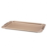 A cookie sheet that knows when to let go, this piece of bakeware is an essential for hassle-free cooking with a strong carbon steel core coated in a durable bronze nonstick finish that provides quick and effortless food release and fast cleaning. Designed with wide rimming along the edge, this cookie sheet is easy to maneuver and handle even with bulky oven mitts. Limited lifetime warranty.