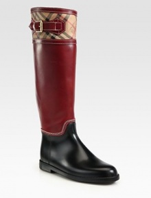 Rainy-weather essential in leather with a traditional Burberry print, featuring adjustable buckle hardware and contrast stitching. Stacked rubber heel, 1 (25mm)Shaft, 15¾Leg circumference, 14½Rubber and leather upperLeather liningRubber solePadded insoleImportedOUR FIT MODEL RECOMMENDS ordering true whole size; ½ sizes should order the next whole size up. 