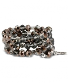 Hematite glass cherry beads adorn this moody coil bracelet from Kenneth Cole New York. Featuring black diamond crystal cup accents and glass crystals. Crafted in silver tone mixed metal. Approximate length: 7-1/2 inches.