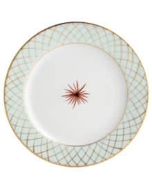 An intricate gold lattice pattern frames a single starburst in the center of this striking salad plate from Bernardaud.