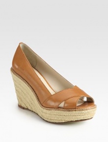 Criss-cross leather straps accompany a hemp, espadrille-inspired wedge. Hemp-covered wedge, 4 (100mm)Covered platform, 1½ (40mm)Compares to a 2½ heel (65mm)Leather upperLeather liningBuffed leather and rubber solePadded insoleImported