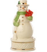 Wishing you a merry Christmas, this porcelain snowman figurine fills your home with song and spirit year after year. Featuring gold buttons, carved accents and a cheery red cardinal in Lenox porcelain. Plays We Wish You a Merry Christmas.