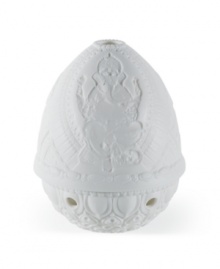 Honor Lord Ganesha with this delicately etched lithopane figurine and votive holder from Lladro. Place a candle inside to bring all of the incredible detail to light.