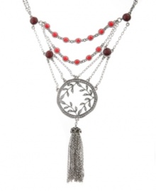 Up-to-the-minute and unique. A tassel embellishment makes Lucky Brand's necklace trendy, while its layered chains and leaf medallion add distinctive detailing. Adorned with semiprecious ruby-hued jade and colored crystals, it's crafted in silver tone mixed metal. Approximate length: 18 inches + 2-inch extender. Approximate drop: 6-1/4 inches.