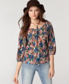 A vintage-inspired silhouette comes to life with a vibrant floral print in this top from Lucky Brand Jeans. Pair it with roughed up denim for weekend style that stays put-together.