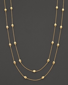 From the Siviglia Collection, the gold necklace with small station gold beads, designed by Marco Bicego. Can be worn doubled or as one long strand.