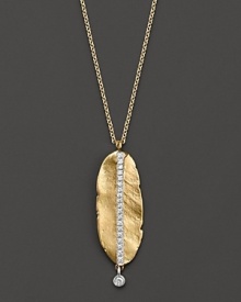 This shining gold leaf, set with sparkling diamonds, evokes early autumn mornings.