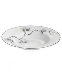 Compose a striking arrangement with the Black Orchid rim soup bowl by Michael Aram. Fine white Limoges porcelain flourishes under a dark watercolor motif inspired by foliage from around the world.