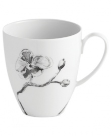 Compose a striking arrangement with the Black Orchid mug by Michael Aram. Fine white Limoges porcelain flourishes under a dark watercolor motif inspired by foliage from around the world.