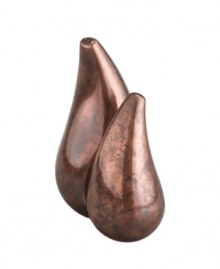 Crafted of alloy and finished in beautiful bronze, these Heritage Pebble salt and pepper shakers from Nambe's collection of serveware add old-world elegance and superior style to any home decor.