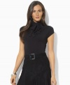 Lauren Ralph Lauren's sleek jersey petite top is modernized with chic cap sleeves and a turtleneck with ties at the side, adding dramatic allure to any look.