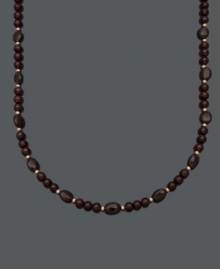 Sophistication in rich red hues. Set off your look with this beautiful necklace highlighting 6 millimeter and 6 x 8 millimeter garnet beads (150 ct. t.w.) and 14k gold accent beads and clasp. Approximate length: 18 inches.