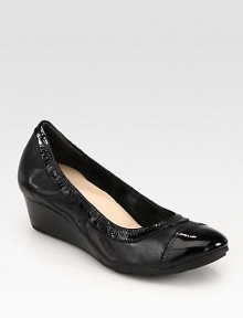 A demi-wedge lifts this leather pump with a timeless patent cap toe and comfortable elasticized trim. Stacked wedge, 1½ (40mm)Leather upper with patent leather trimLeather lining and solePadded insoleImported