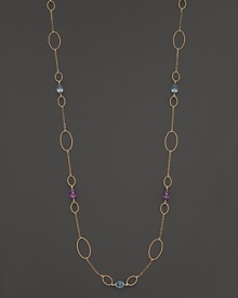 Faceted oval amethyst and blue topaz add rich sparkle to 14K yellow gold. By Nancy B.