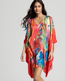 A watercolor-like jungle print embellishes this luxuriously soft satin tunic from Natori.