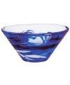 A dramatic accent, the Tempera Blue bowl features heavy glass laced with hand-painted swirls of deep blue. Designed by Anna Ehrner for Kosta Boda.