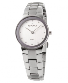 Distinct yet understated, this Skagen Denmark watch carries timeless grace. Silvertone stainless steel bracelet and round case. Round white dial with logo and Swarovski crystal accent indices. Quartz movement. Water resistant to 30 meters. Limited lifetime warranty.