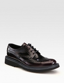 Leather wing-tip style with rubber sole and colored micro detail.Leather upperLeather liningRubber soleMade in Italy