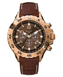 Ruggedly handsome with superior functionality, this Nautica watch features a croc-embossed leather strap and round goldtone stainless steel case. Chronograph brown dial features goldtone stick indices, logo, date window and three subdials. Analog movement. Water resistant to 100 meters. Five-year limited warranty.