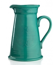 Homegrown style. An organic shape and engraved florals give the Espana Antica pitcher a handcrafted feel that suits country settings. With a glossy teal finish. From the Tabletops Unlimited dinnerware collection.