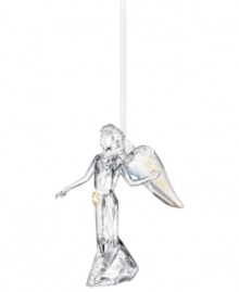 Inspire peace and tranquility with an awe-inspiring angel ornament. Shining in clear Swarovski crystal with iridescent wings and a golden star, it's a beautiful addition to the table or tree. Skirt engraved with 2012.