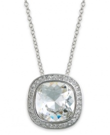 Elegance made simple, by Swarovski. This darling pendant necklace features a large, clear crystal surrounded by clear crystal pave. Crafted in rhodium-plated mixed metal. Approximate length: 15 inches + 1-1/2-inch extender. Approximate drop 5/8 inch.