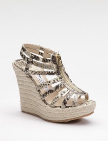 Ultra exotic, this strappy style in snake-printed metallic leather zips up the front and perches atop an espadrille platform wedge.Rope-covered wedge, 4¾ (120mm) Covered platform, 1½ (40mm) Compares to a 3¼ heel (80mm) Leather upper Front zipper Leather lining Padded insole Rubber sole Made in ItalyOUR FIT MODEL RECOMMENDS ordering true whole size; ½ sizes should order the next whole size up. 