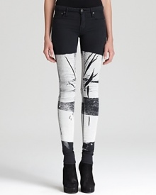 These Helmut Lang skinny jeans boast an edgy bar print in black and white tones for a modern take on the printed denim trend. Take the directional look downtown with tough-luxe booties and a tissue-thin tee.