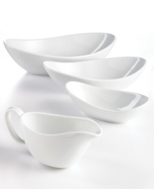 This multi-purpose serving bowl does it all, transitioning smoothly from the oven or microwave and into the dishwasher in timeless white porcelain. An elliptical shape presents sides and dips with modern grace. From The Cellar's collection of serveware and serving dishes.