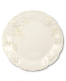 With embossed lilies and golden leaves, Portmeirion's decorated Fleur de Lys dinner plate sets tables in the French tradition. Classic, scalloped stoneware in warm ivory lends distinct old-world elegance to everyday dining.