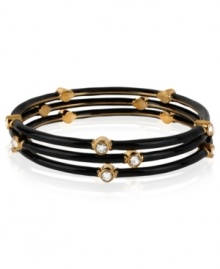 The power of three comes through in this bangle set from Kenneth Cole New York. Gold-tone mixed metal sets the foundation for these black bracelets, with glass crystal details added for luster. Approximate diameter: 2-1/2 inches.