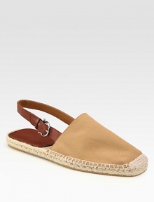 Classic espadrille style with neutral canvas upper and adjustable leather slingback strap.Canvas upperRubber soleImported