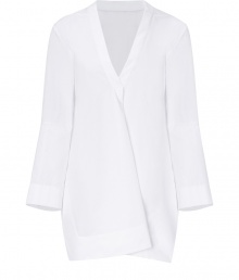 With modern-minimalist detailing and a contemporary cut, Jil Sanders pristine white cotton tunic is an effortless chic choice - V-neckline with folded front detail, long sleeves, cut-out slit sides, longer back - Loose fit - Wear over slim-fit separates with sleek leather flats