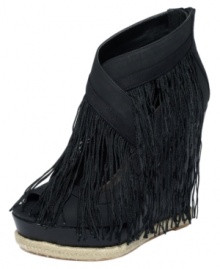 The fringe benefits are endless. RACHEL Rachel Roy's Somera platform wedge sandals feature crisscrossing straps at the vamp with super long fringe detail all around.