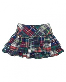 A bright patchwork plaid cotton skirt features tiers of ruffles for a fun and girlie look.