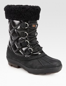 Lined with plush shearling, this lace-up essential combines quilted canvas and rich suede for a textured look. Shaft, 8Leg circumference, 11Coated canvas and suede upper with shearling trimSide zipShearling liningRubber trek solePadded insoleImported