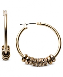 Adding to the glamour, Fossil's hoop earrings, crafted from gold-tone mixed metal, get an extra bit of elegance with shiny rondelles for a stunning effect. Approximate drop: 1-1/4 inches.