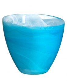 Electrify your home with the eye-catching Candy Blue collection from Sea Glasbruk. Caribbean blues swirl and wrap the minimalist glass votive in a sweet celebration of color. With an askew rim and slick, glazed finish.