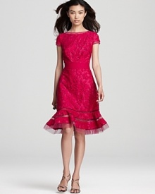 Tadashi Shoji's vibrant lace dress lends drama with a flared hem, detailed with sheer mesh stripes for a modern look.